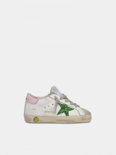 Super-Star golden goose sneakers with green glitter star and pin